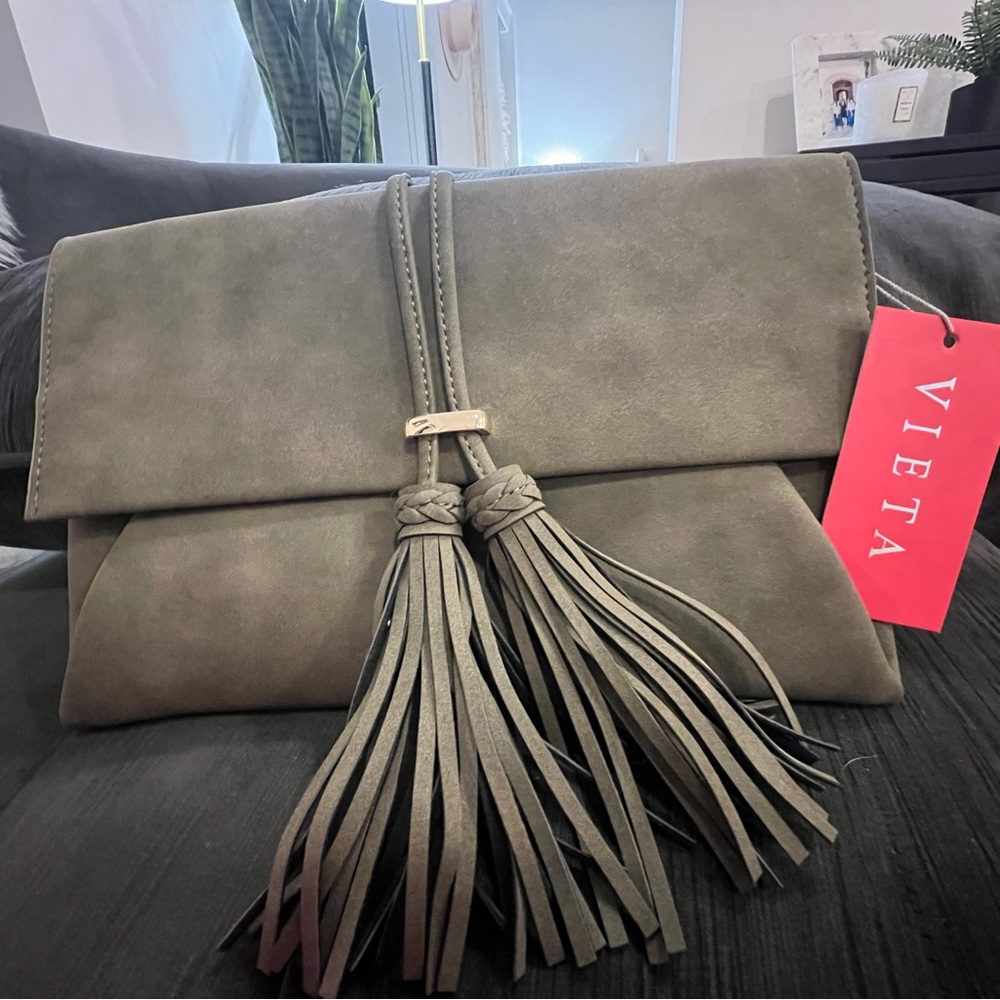 Olive/Army green clutch w/tassel. Also optional strap. NWT, never used